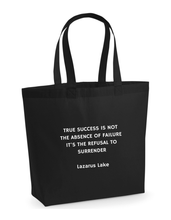 Load image into Gallery viewer, Black tote bag with white text on a white background