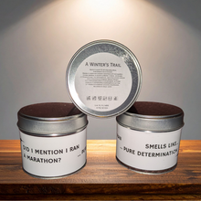 Load image into Gallery viewer, Three metal cans with humorous labels on a wooden surface