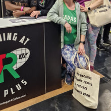 Load image into Gallery viewer, Group of runners posing with tote bags