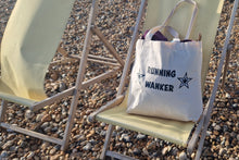 Load image into Gallery viewer, Beach bag with 'Running Wanker' text on a chair at the beach
