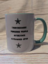 Load image into Gallery viewer, White mug with teal handle and humorous text on a wooden surface
